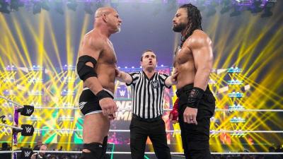 Goldberg y Roman Reigns