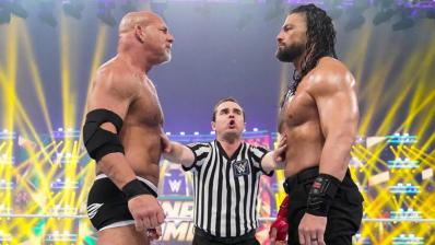 Goldberg y Roman Reigns