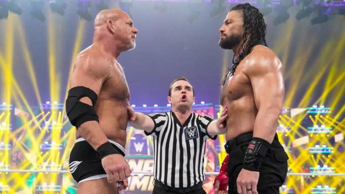 Goldberg y Roman Reigns